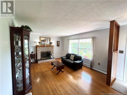 97 University Avenue, Chatham, NB - Indoor Photo Showing Living Room With Fireplace