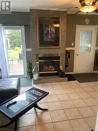 97 University Avenue, Chatham, NB - Indoor Photo Showing Living Room With Fireplace