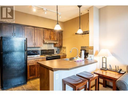 1545 Kicking Horse Trail Unit# 107, Golden, BC - Indoor Photo Showing Kitchen With Double Sink