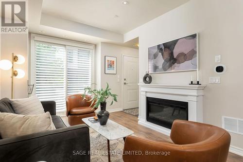 5 - 80 Eastwood Park Gardens, Toronto, ON - Indoor Photo Showing Living Room With Fireplace