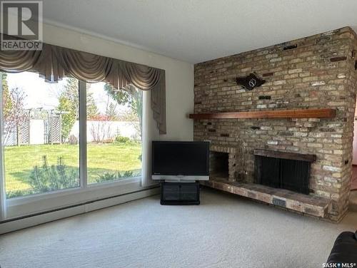 48 Vanier Drive, Melville, SK - Indoor Photo Showing Living Room With Fireplace