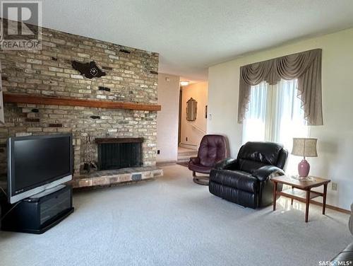 48 Vanier Drive, Melville, SK - Indoor Photo Showing Living Room With Fireplace