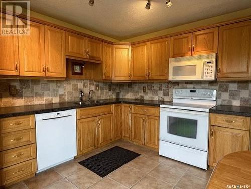 48 Vanier Drive, Melville, SK - Indoor Photo Showing Kitchen With Double Sink