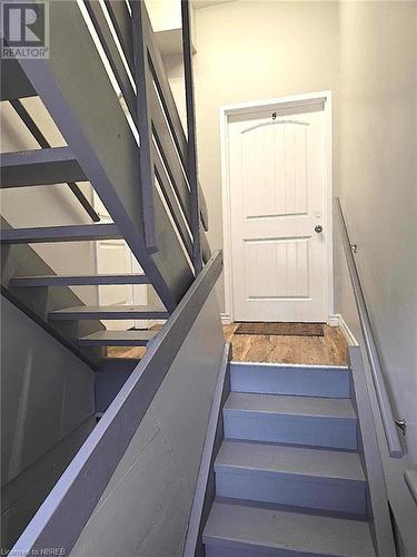 Clean and bright common stairs - 488 Main Street, Powassan, ON - Indoor Photo Showing Other Room