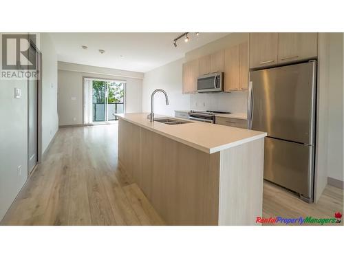 210 7001 Royal Oak Avenue, Burnaby, BC - Indoor Photo Showing Kitchen With Double Sink