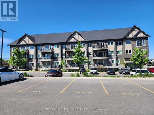 302 - 340 Florence Drive, Peterborough, ON - Outdoor With Balcony With Facade