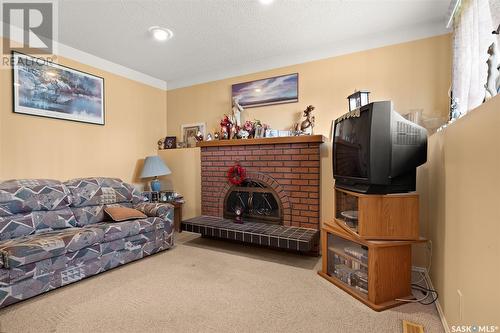 75 Groome Avenue, Regina, SK - Indoor Photo Showing Living Room With Fireplace