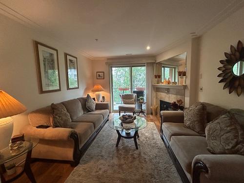 303-2125 Atkinson Street, Penticton, BC - Indoor Photo Showing Living Room With Fireplace