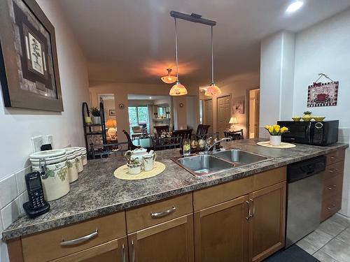 303-2125 Atkinson Street, Penticton, BC - Indoor Photo Showing Kitchen With Double Sink