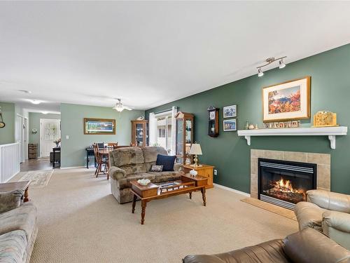 48-2675 Pine Avenue, Lumby, BC - Indoor Photo Showing Living Room With Fireplace