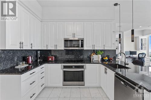 Stainless kitchen appliances, granite countertops, approx. 500sq ft imported Italian Carerra Calacatta Marble, upgraded kitchen backsplash, full-size kitchen - 805 Carling Avenue Unit#4003, Ottawa, ON - Indoor Photo Showing Kitchen With Upgraded Kitchen