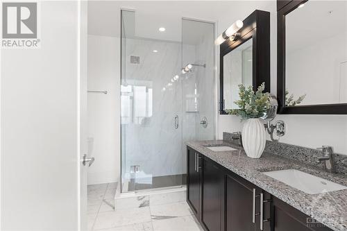 Upgraded ensuite marble shower tile, comfort height (ADA) toilet in ensuite bathroom as well as 2nd bathroom - 805 Carling Avenue Unit#4003, Ottawa, ON - Indoor Photo Showing Bathroom
