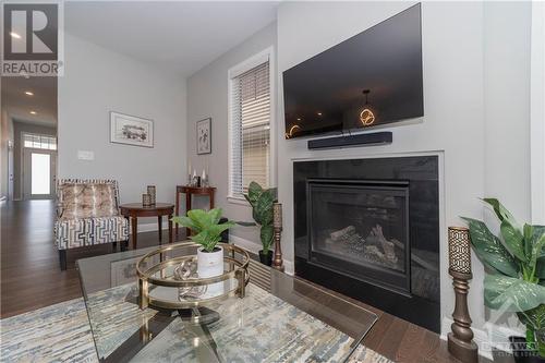 Living Room with Gas Fireplace and Hardwood Floors - 340 Kilspindie Ridge, Ottawa, ON - Indoor Photo Showing Living Room With Fireplace