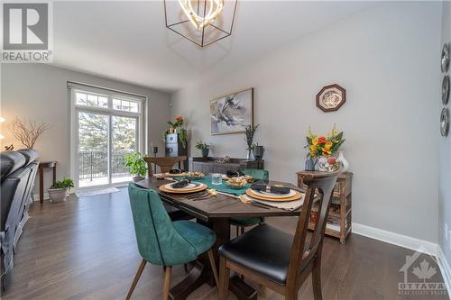 Dining Room with Hardwood Floors and Walk-Out Deck - 340 Kilspindie Ridge, Ottawa, ON - Indoor Photo Showing Dining Room