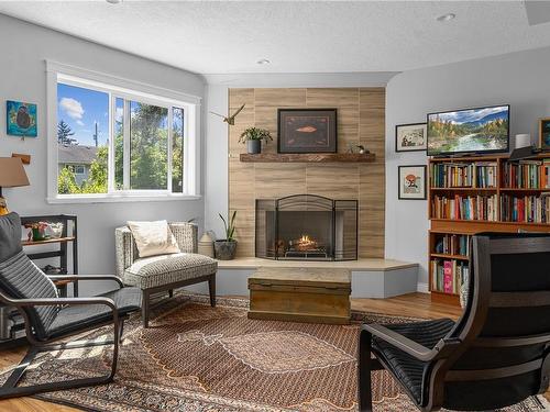110-1709 Mckenzie Ave, Saanich, BC - Indoor Photo Showing Living Room With Fireplace