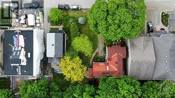 Lots side by side - red roof is 561 Edison, tiny grey roof is 565 Edison. - 