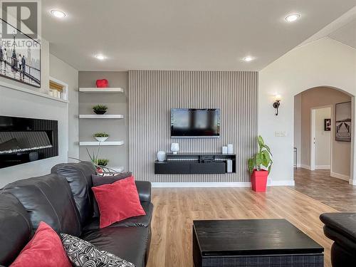 1551 3 Highway E, Osoyoos, BC - Indoor Photo Showing Living Room With Fireplace