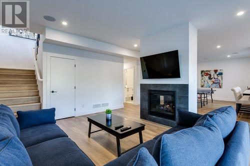 927 Carnoustie Drive, Kelowna, BC - Indoor Photo Showing Living Room With Fireplace