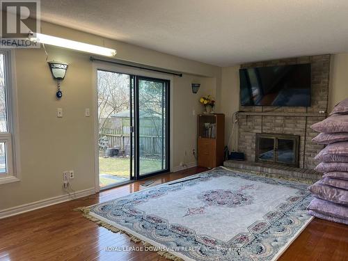 17 Kenscott Road N, Toronto, ON - Indoor Photo Showing Living Room With Fireplace