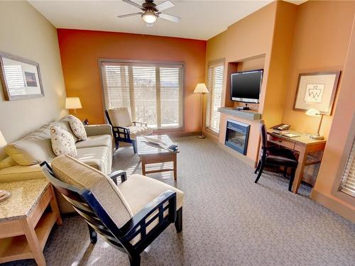 357C-1200 Rancher Creek Road, Osoyoos, BC - Indoor Photo Showing Living Room With Fireplace