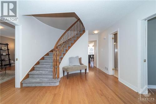 Front Hall with Hardwood Floors and Circular Staircase - 48 Marble Arch Crescent, Ottawa, ON - Indoor Photo Showing Other Room