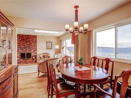 2452 Cardena Cres, Port Mcneill, BC - Indoor Photo Showing Dining Room With Fireplace