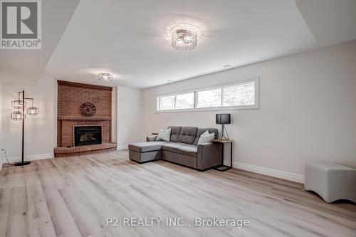 8148 Niven Street, Niagara Falls, ON - Indoor Photo Showing Living Room With Fireplace