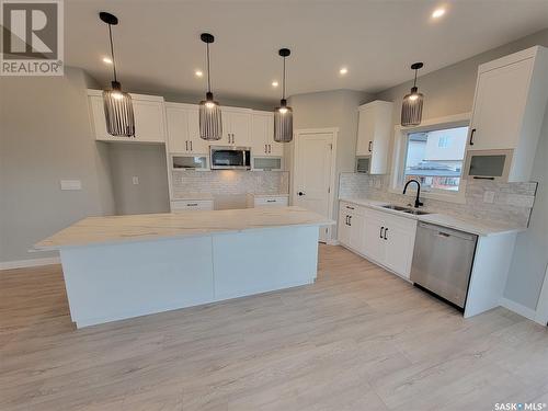 104 Thakur Street, Saskatoon, SK - Indoor Photo Showing Kitchen With Double Sink With Upgraded Kitchen