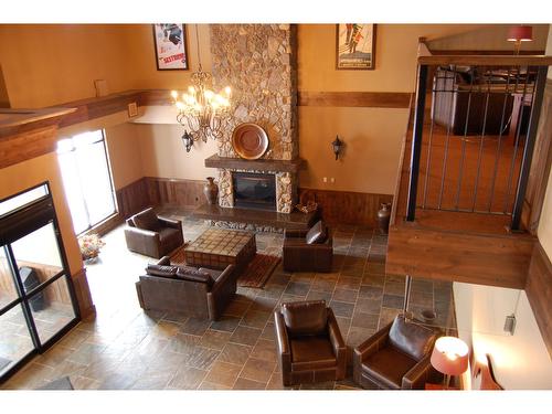 303 - 1549 Kicking Horse Trail, Golden, BC - Indoor With Fireplace