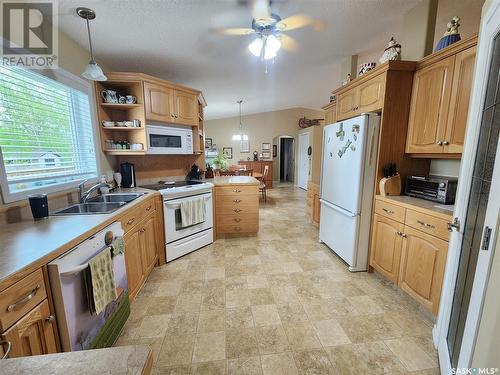 225 3Rd Street, North Weyburn, SK - Indoor Photo Showing Kitchen With Double Sink