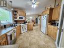 225 3Rd Street, North Weyburn, SK  - Indoor Photo Showing Kitchen With Double Sink 