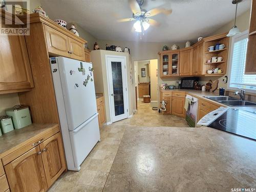 225 3Rd Street, North Weyburn, SK - Indoor Photo Showing Kitchen With Double Sink