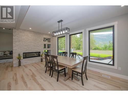 50 Foxwood Road, Grindrod, BC - Indoor Photo Showing Dining Room With Fireplace
