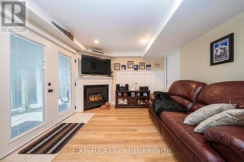 28 Thrushwood Trail, Kawartha Lakes, ON - Indoor Photo Showing Living Room With Fireplace