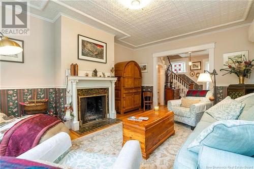 52 Centennial Road, Hampton, NB - Indoor Photo Showing Living Room With Fireplace