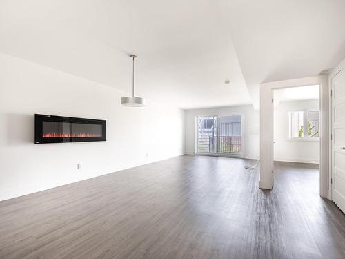 Vue d'ensemble - 441  - 445 Rue D'Ambre, Candiac, QC - Indoor With Fireplace