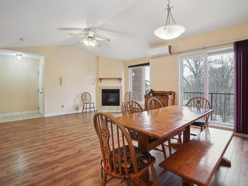 Living room - 165 Boul. De La Cité-Des-Jeunes, Vaudreuil-Dorion, QC - Indoor Photo Showing Dining Room With Fireplace