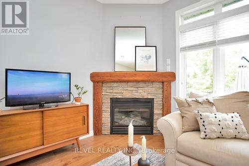 1864 Jubilee Drive, London, ON - Indoor Photo Showing Living Room With Fireplace