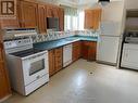 1 - 1396 Wilson Road N, Oshawa, ON  - Indoor Photo Showing Kitchen With Double Sink 