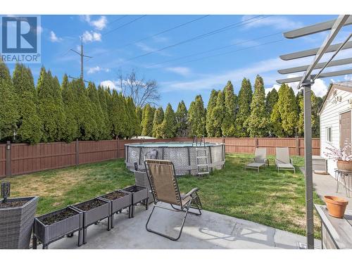 384 Klassen Road, Kelowna, BC - Outdoor With Above Ground Pool With Backyard