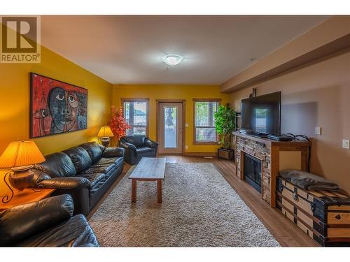 5401 Lakeshore Drive Unit# 104, Osoyoos, BC - Indoor Photo Showing Living Room With Fireplace