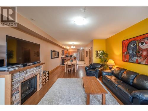 5401 Lakeshore Drive Unit# 104, Osoyoos, BC - Indoor Photo Showing Living Room With Fireplace