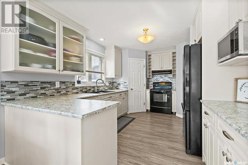 119 Buckwold Cove, Saskatoon, SK - Indoor Photo Showing Kitchen With Upgraded Kitchen