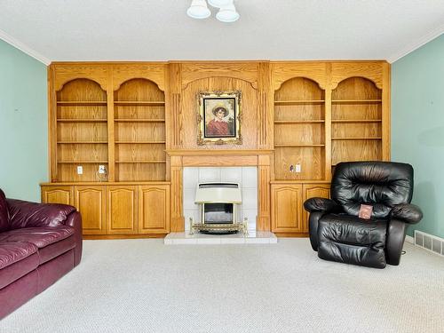 2411 2Nd Street N, Cranbrook, BC - Indoor Photo Showing Living Room With Fireplace