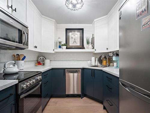 106-1031 Burdett Ave, Victoria, BC - Indoor Photo Showing Kitchen With Stainless Steel Kitchen With Upgraded Kitchen