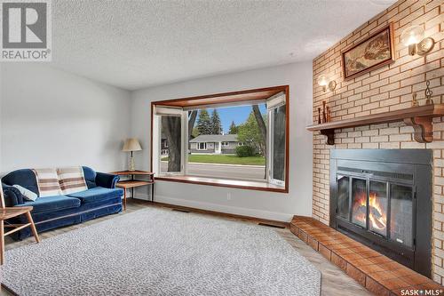 2530 Cumberland Avenue S, Saskatoon, SK - Indoor Photo Showing Living Room With Fireplace