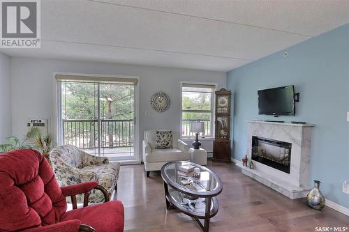 208 1901 1 1/2 Avenue W, Prince Albert, SK - Indoor Photo Showing Living Room With Fireplace