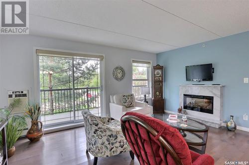 208 1901 1 1/2 Avenue W, Prince Albert, SK - Indoor Photo Showing Living Room With Fireplace