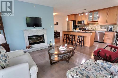 208 1901 1 1/2 Avenue W, Prince Albert, SK - Indoor Photo Showing Living Room With Fireplace