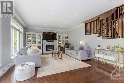 889 Bunchberry Way, Ottawa, ON - Indoor Photo Showing Living Room With Fireplace
